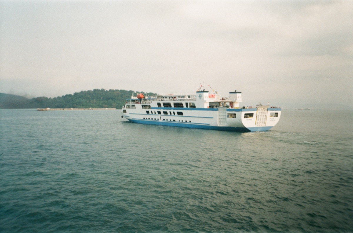 Large group of travelers enjoying organized ferry journey with coordinated accommodation and activities