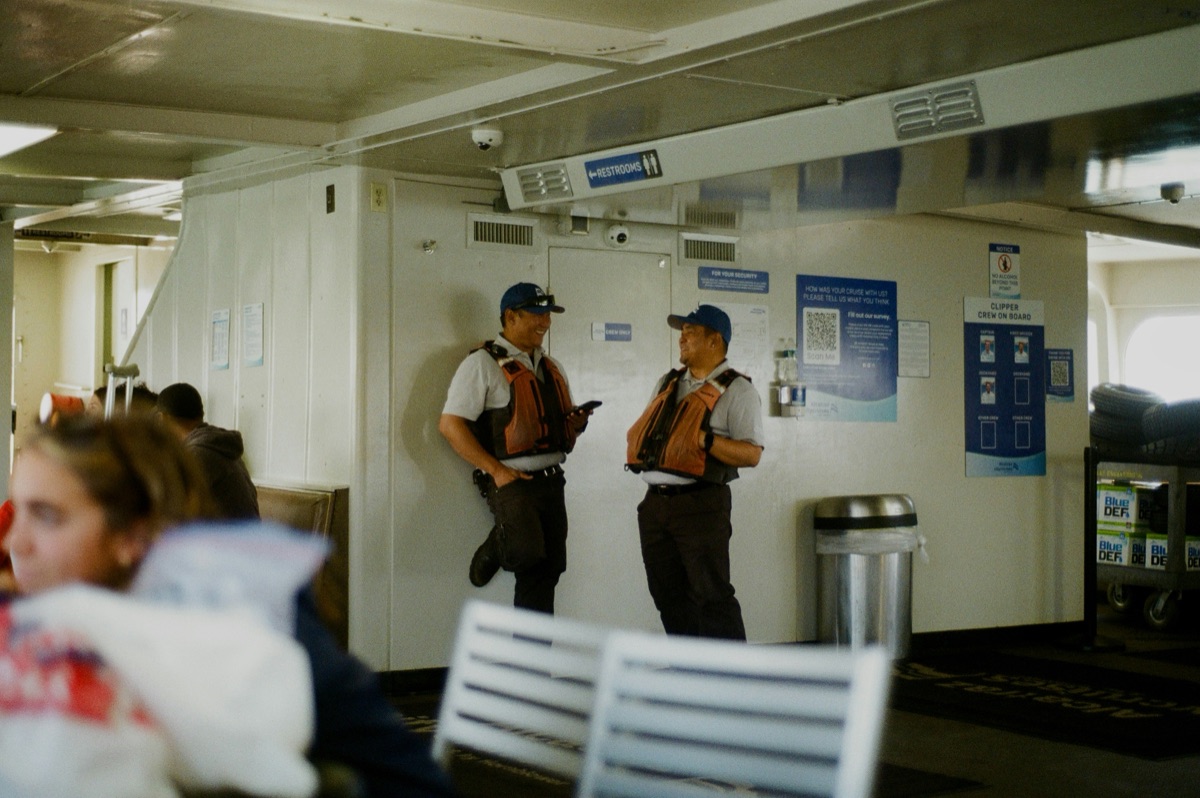 Ferry customer service desk with staff helping passengers