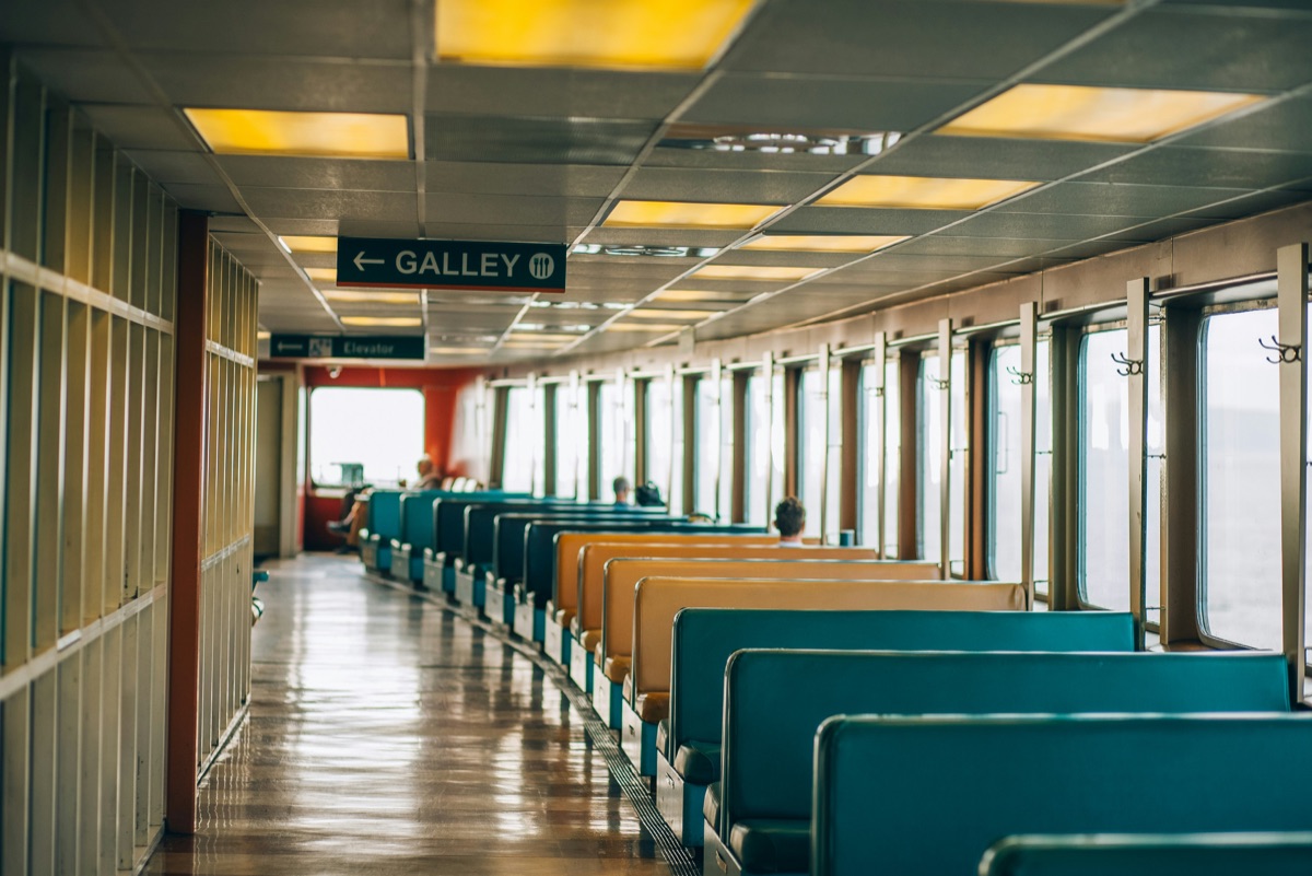 Modern ferry interior with comfortable seating area and passenger amenities